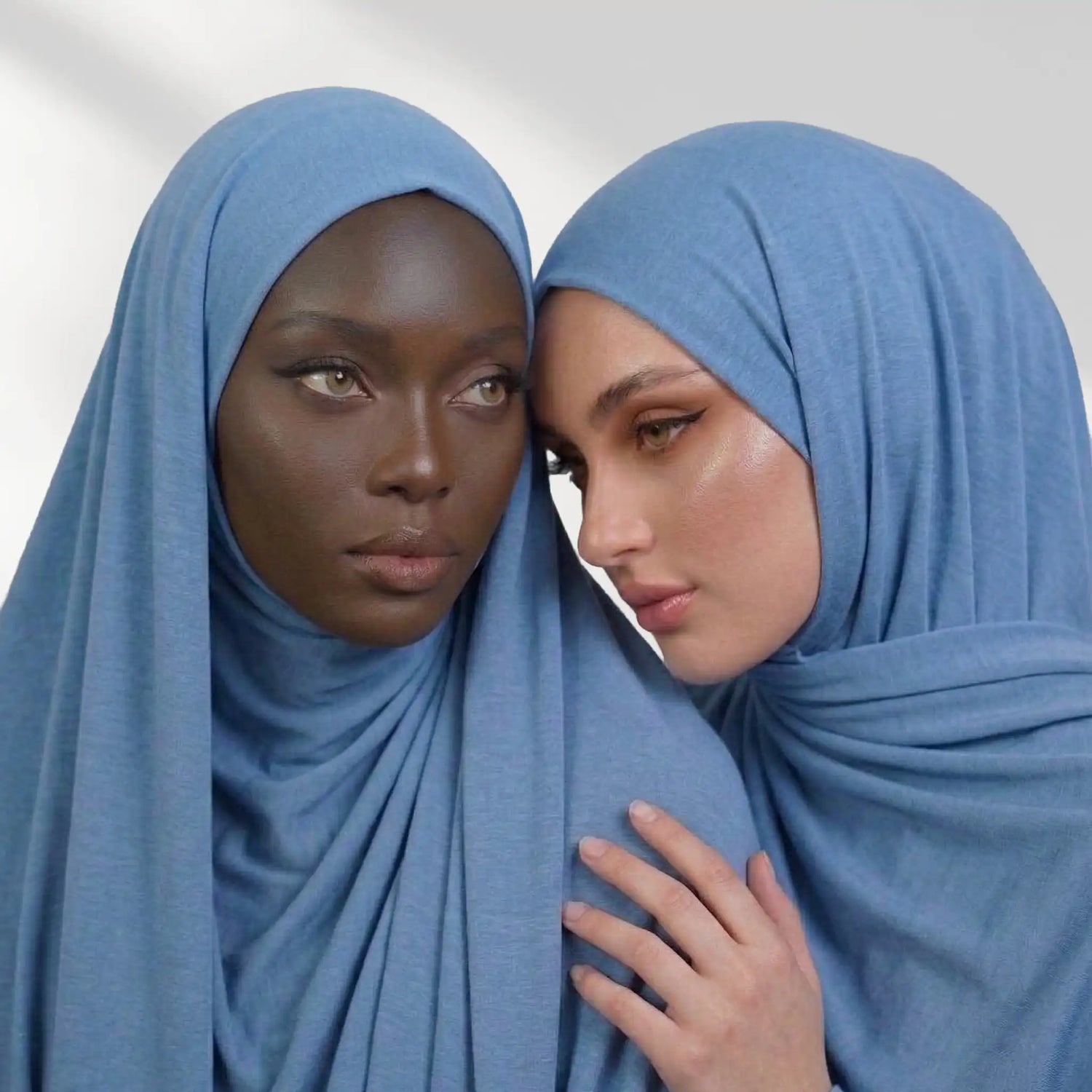 "Dark blue instant jersey hijab adorning a woman’s head."