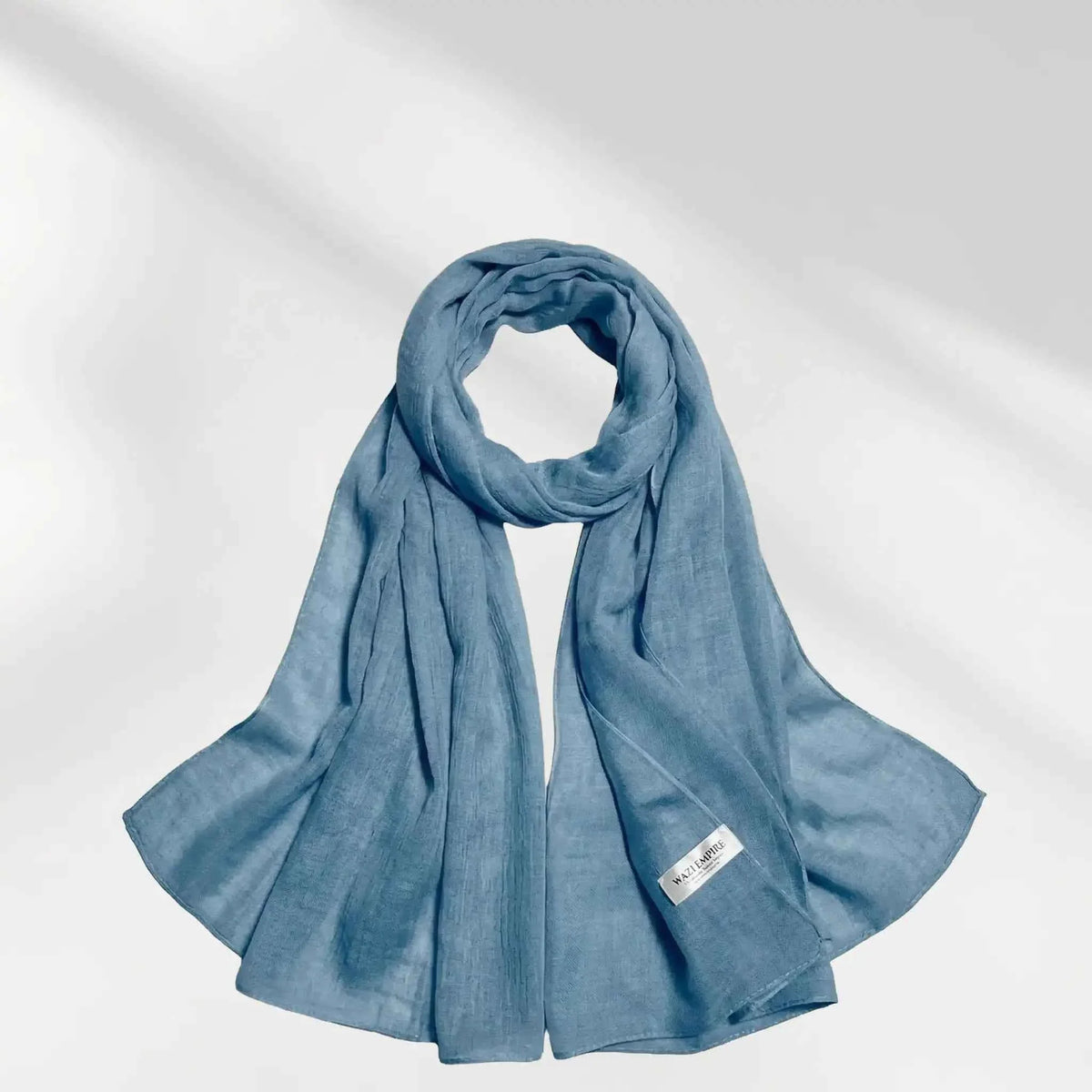 Blue modal hijab scarf draped to show its soft lightweight fabric and drape