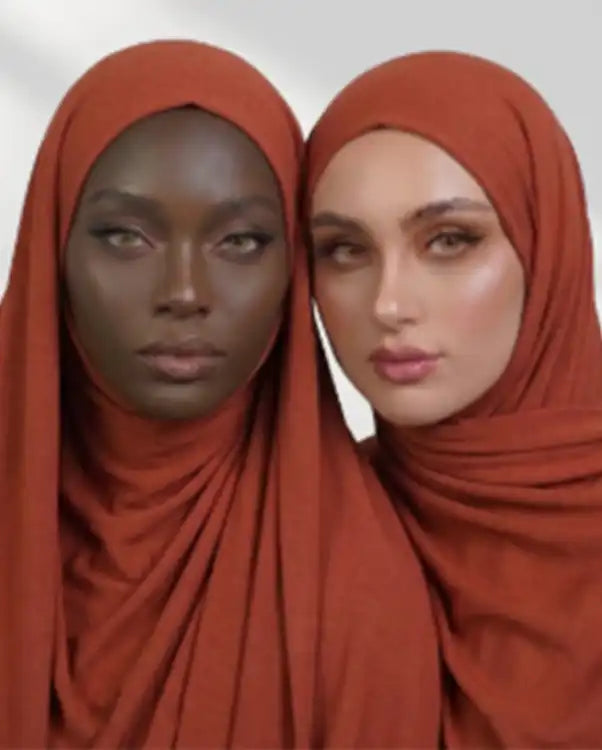Two women wearing red modal hijabs