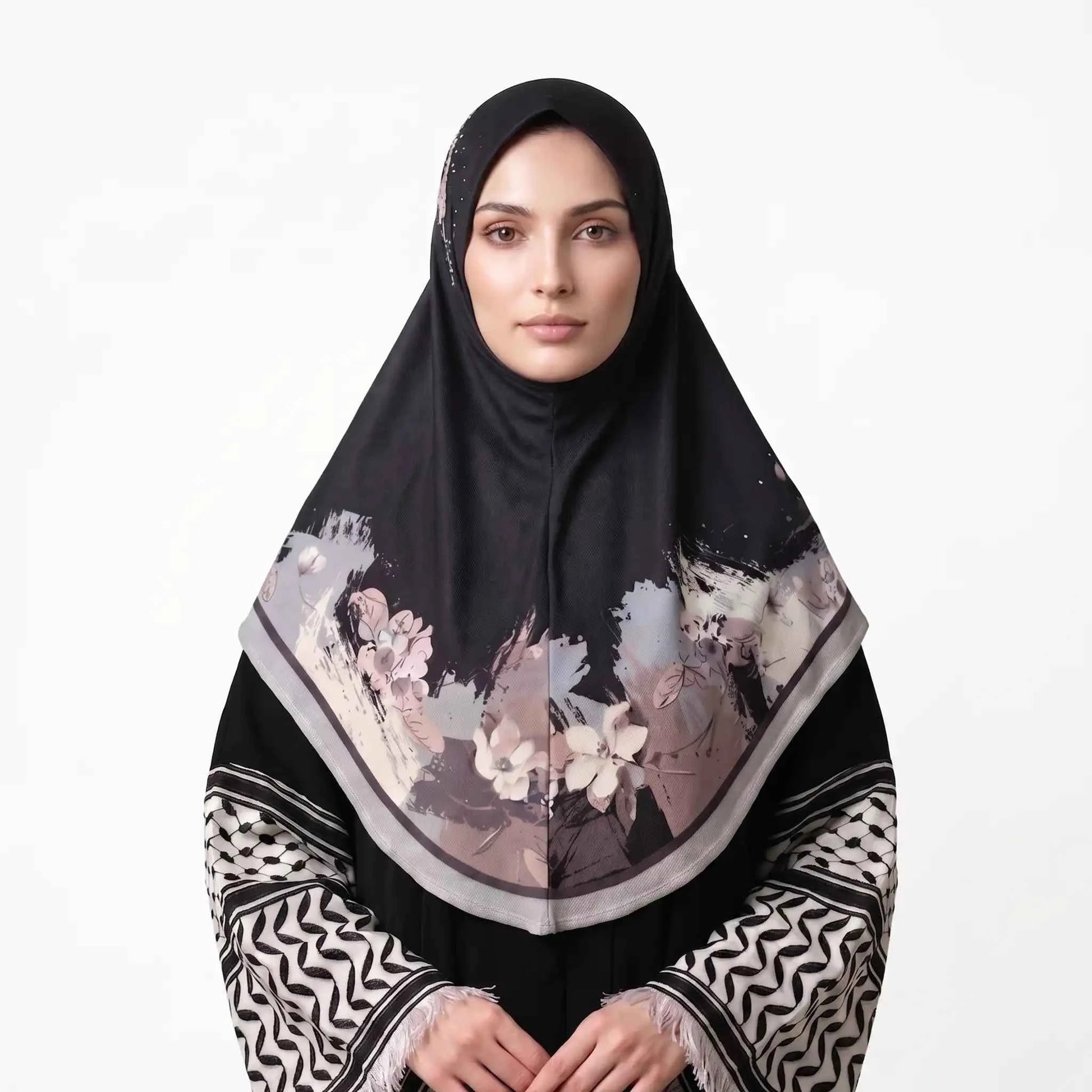 Woman wearing a black floral instant hijab, front view — one piece slip on hijab with blush pink and ivory watercolor flower border