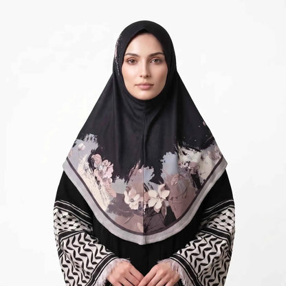 Woman wearing a black floral instant hijab, front view — one piece slip on hijab with blush pink and ivory watercolor flower border