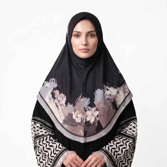 Woman wearing a black floral instant hijab, front view — one piece slip on hijab with blush pink and ivory watercolor flower border