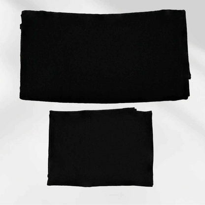Black jersey hijab folded with its matching hijab cap, shown as a complete set