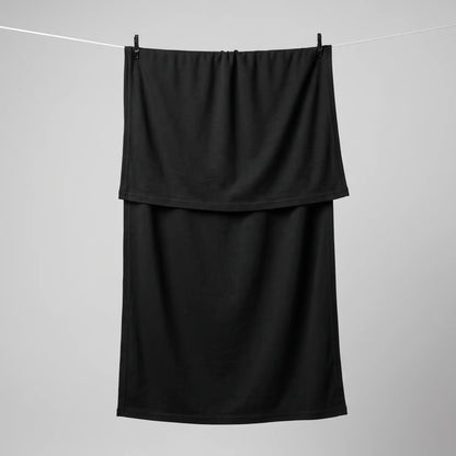 Full length black jersey hijab hanging on a line