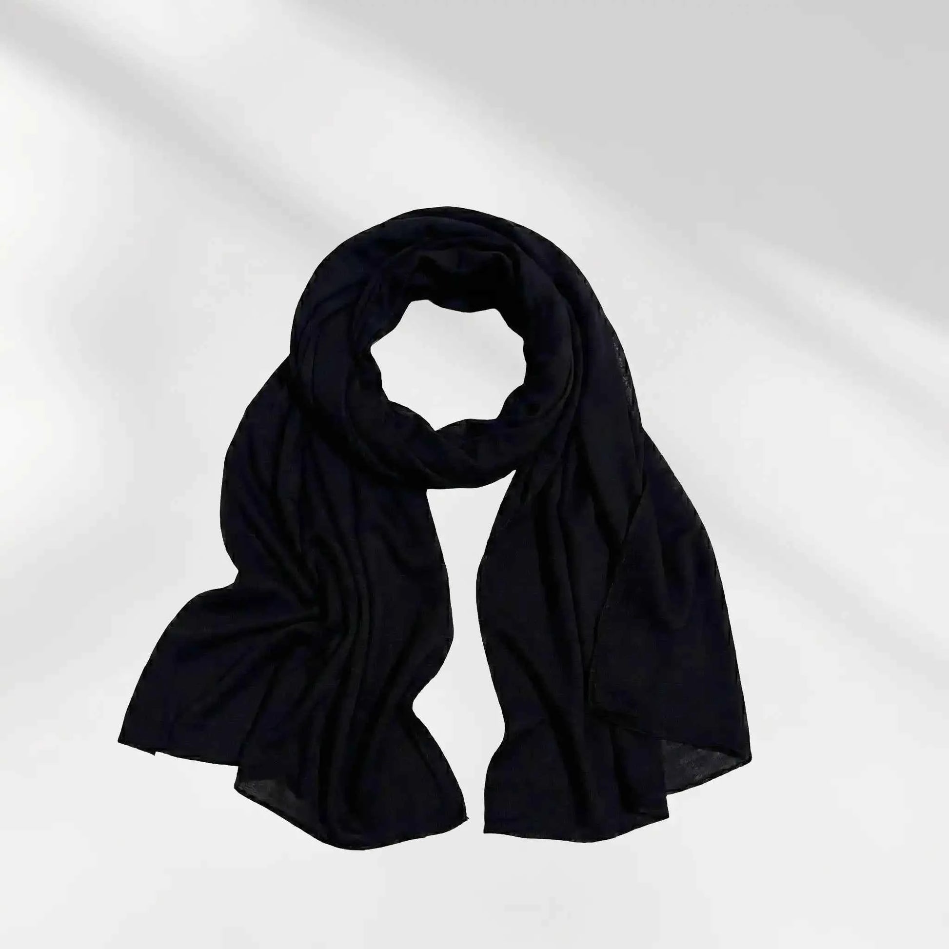 Black modal hijab scarf loosely coiled to show the drape of the fabric