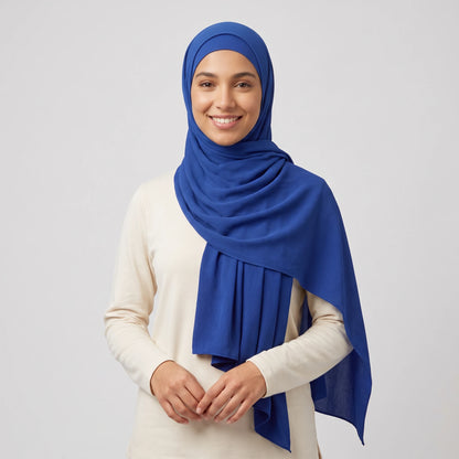 Woman wearing a royal blue jersey hijab with a matching hijab cap