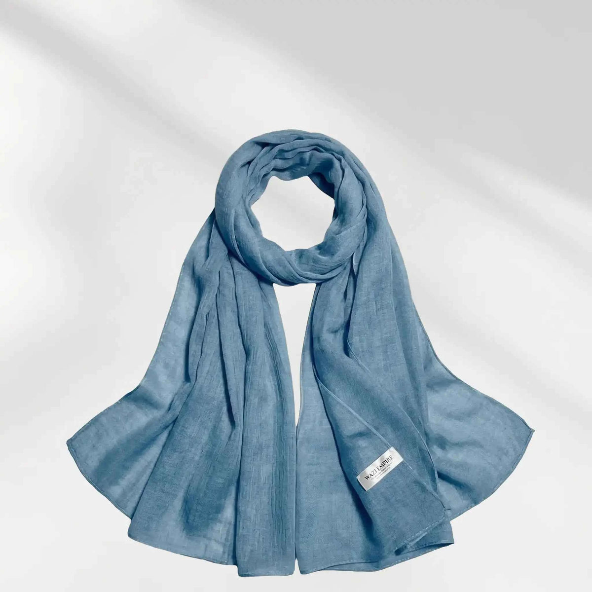 Blue modal hijab scarf draped to show its soft lightweight fabric and drape