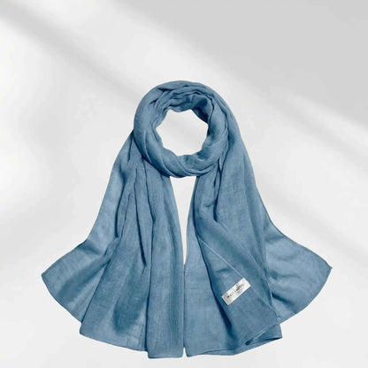 Blue modal hijab scarf draped to show its soft lightweight fabric and drape