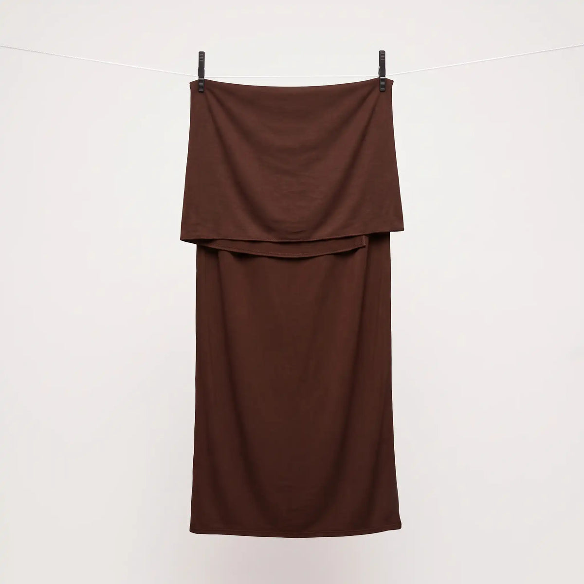 Full length brown jersey hijab hanging on a line