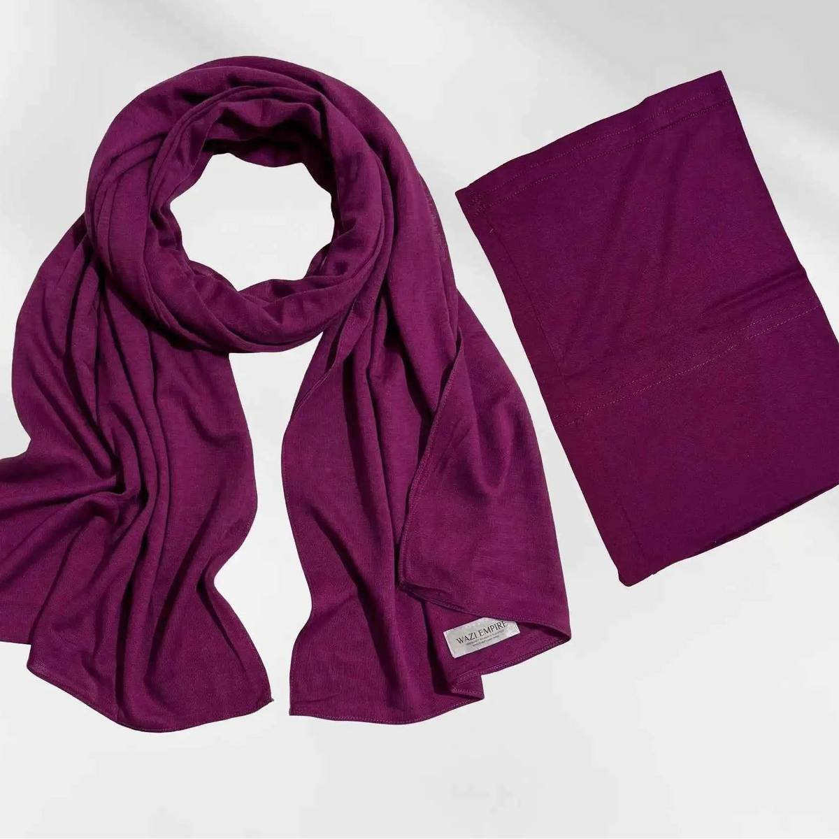 Burgundy modal hijab and matching hijab cap shown together as a complete set, with the Wazi Empire label visible