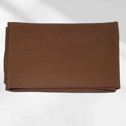Folded chocolate brown chiffon hijab showing the fabric surface and finished edge