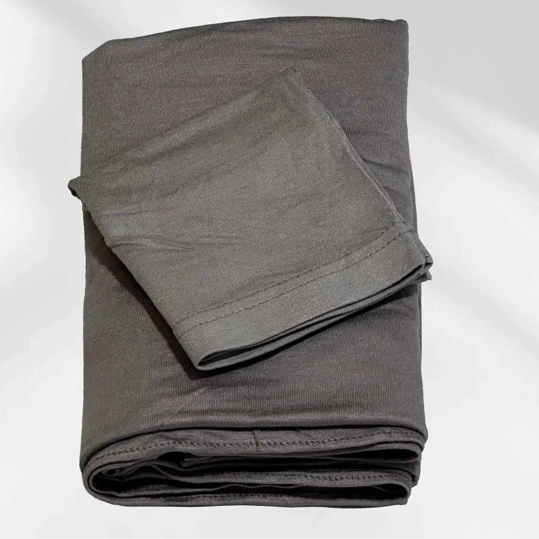 Gray jersey hijab and matching hijab cap laid flat, showing the soft stretch fabric