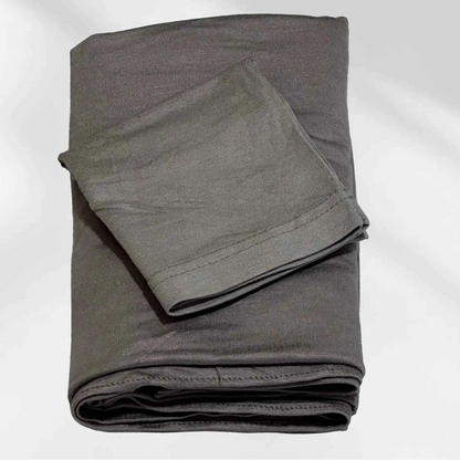 Gray jersey hijab and matching hijab cap laid flat, showing the soft stretch fabric