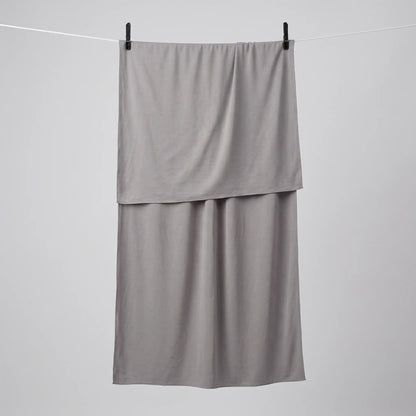 Full length grey jersey hijab hanging on a line
