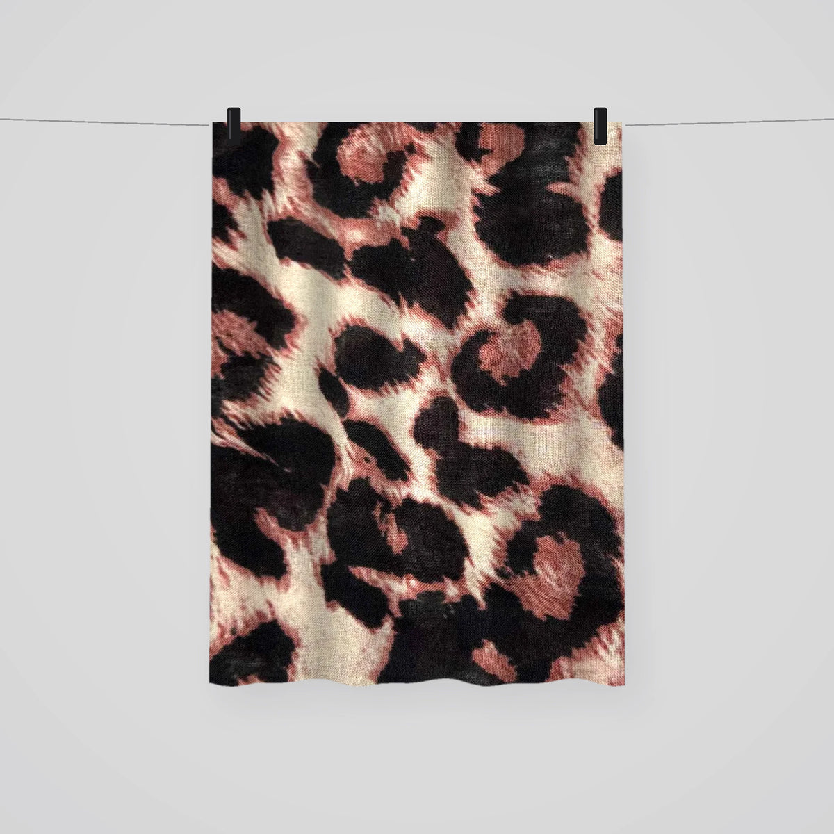 Full length leopard print hijab hanging on a line