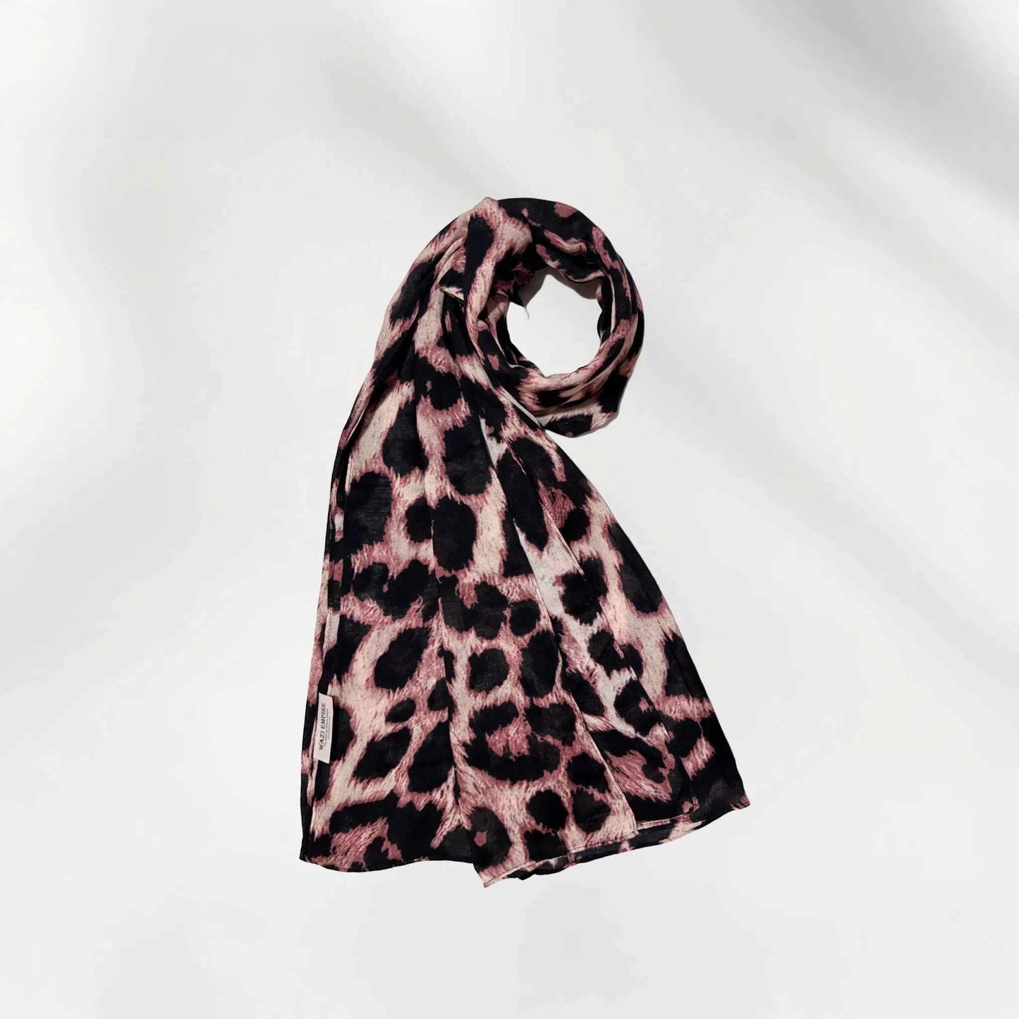 Leopard print modal hijab coiled to show the lightweight drape and animal print