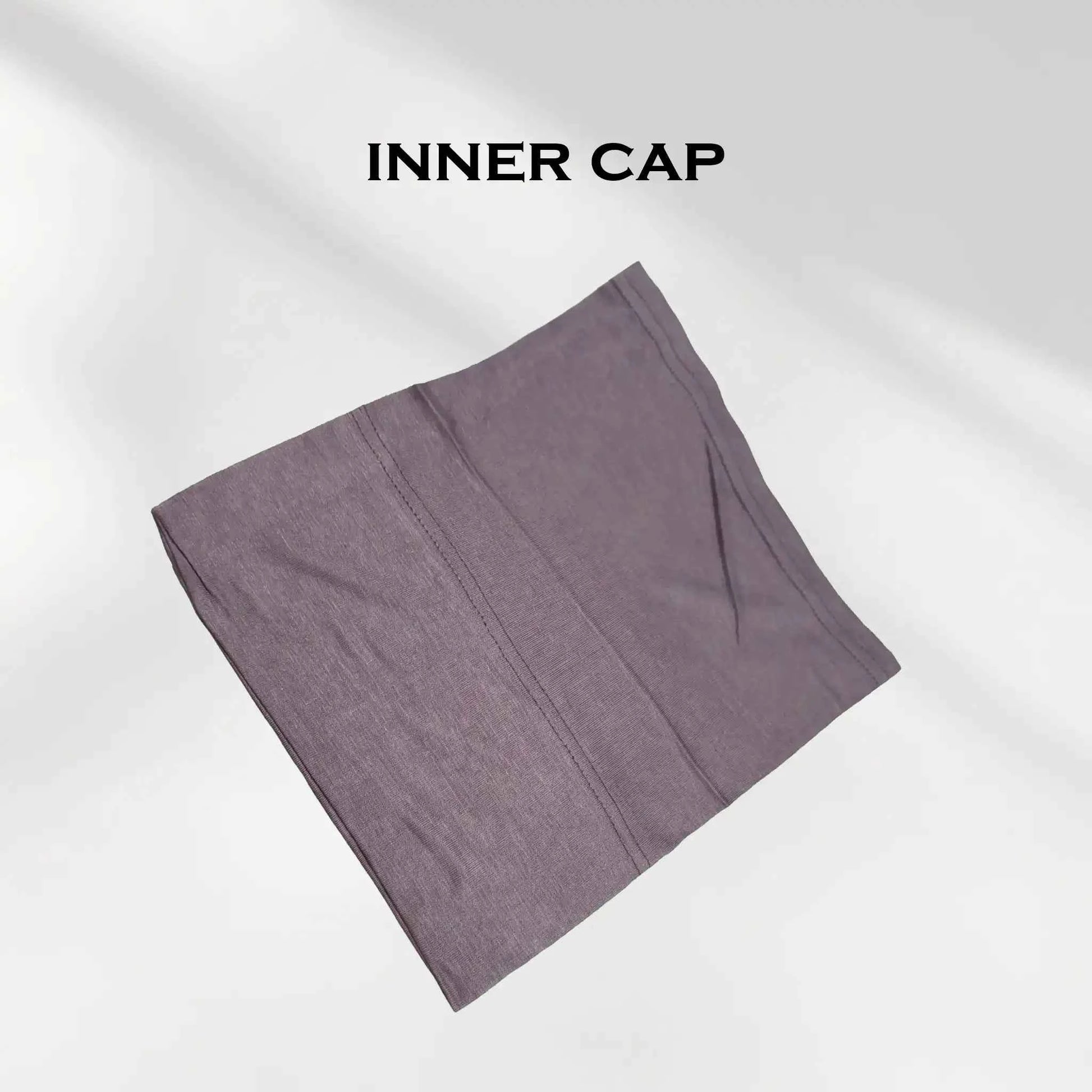 Folded mauve grey hijab undercap showing the flat seam and stretch jersey knit
