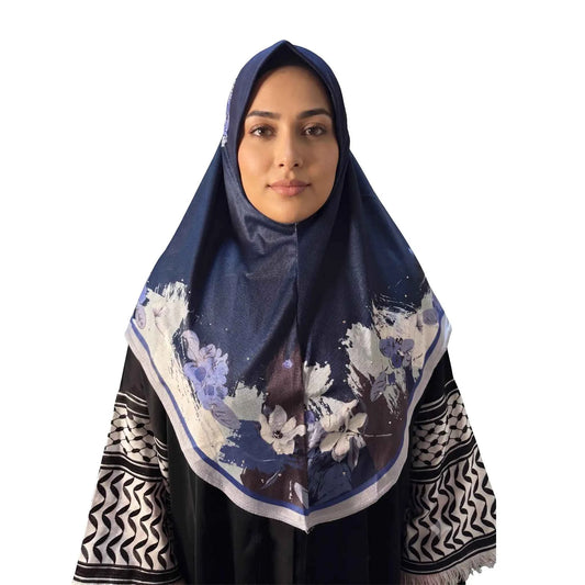 Woman wearing a navy blue floral instant hijab, front view — one piece slip on hijab with periwinkle and ivory watercolor flower border