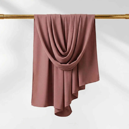 Pink chiffon hijab in a dusty rose shade, shown to display the soft muted tone