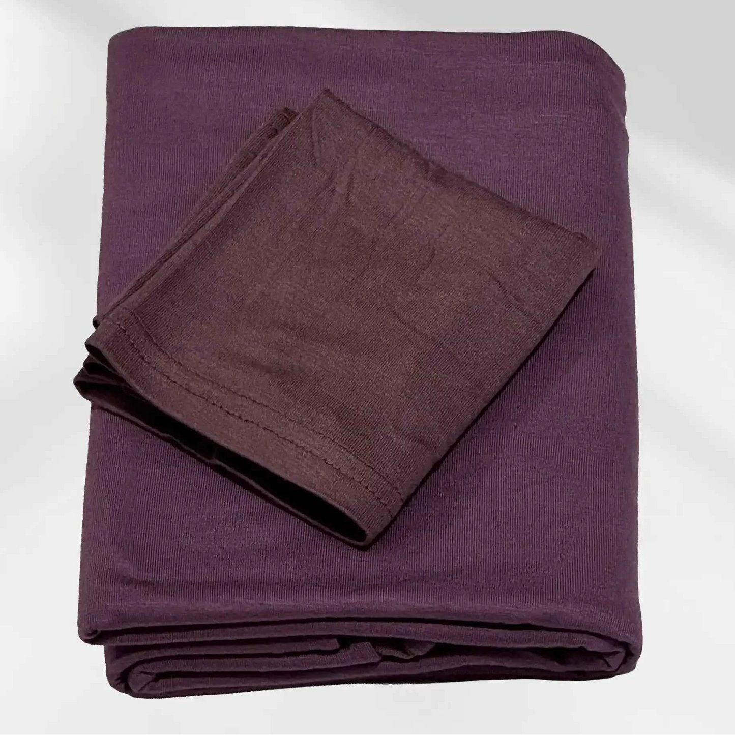 Purple jersey hijab shown with the separate matching hijab cap beside it
