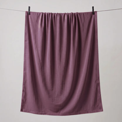 Full length purple jersey hijab hanging on a line