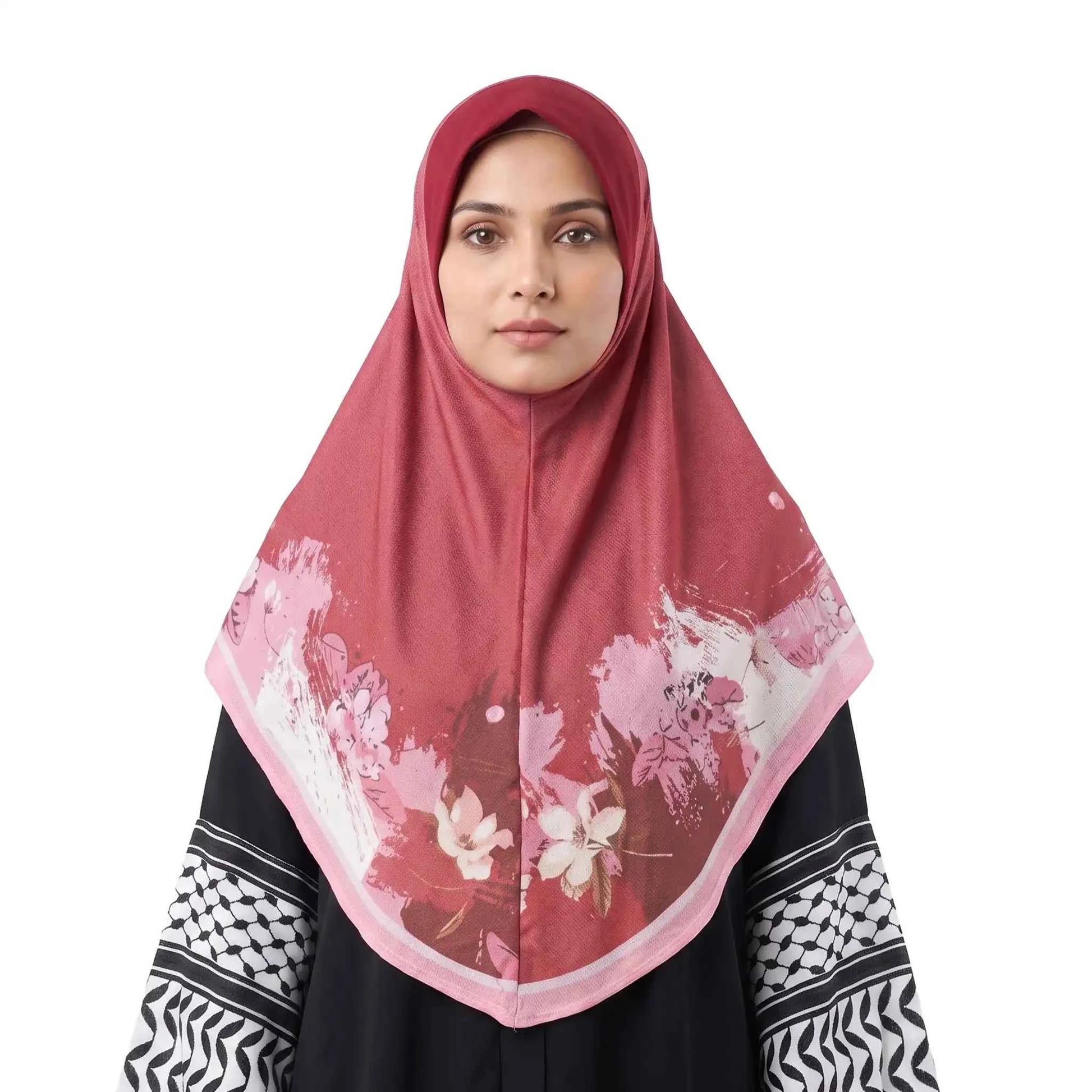 Woman wearing a red floral instant hijab, front view — one piece square hijab in berry red with a blush pink and ivory watercolor flower border.