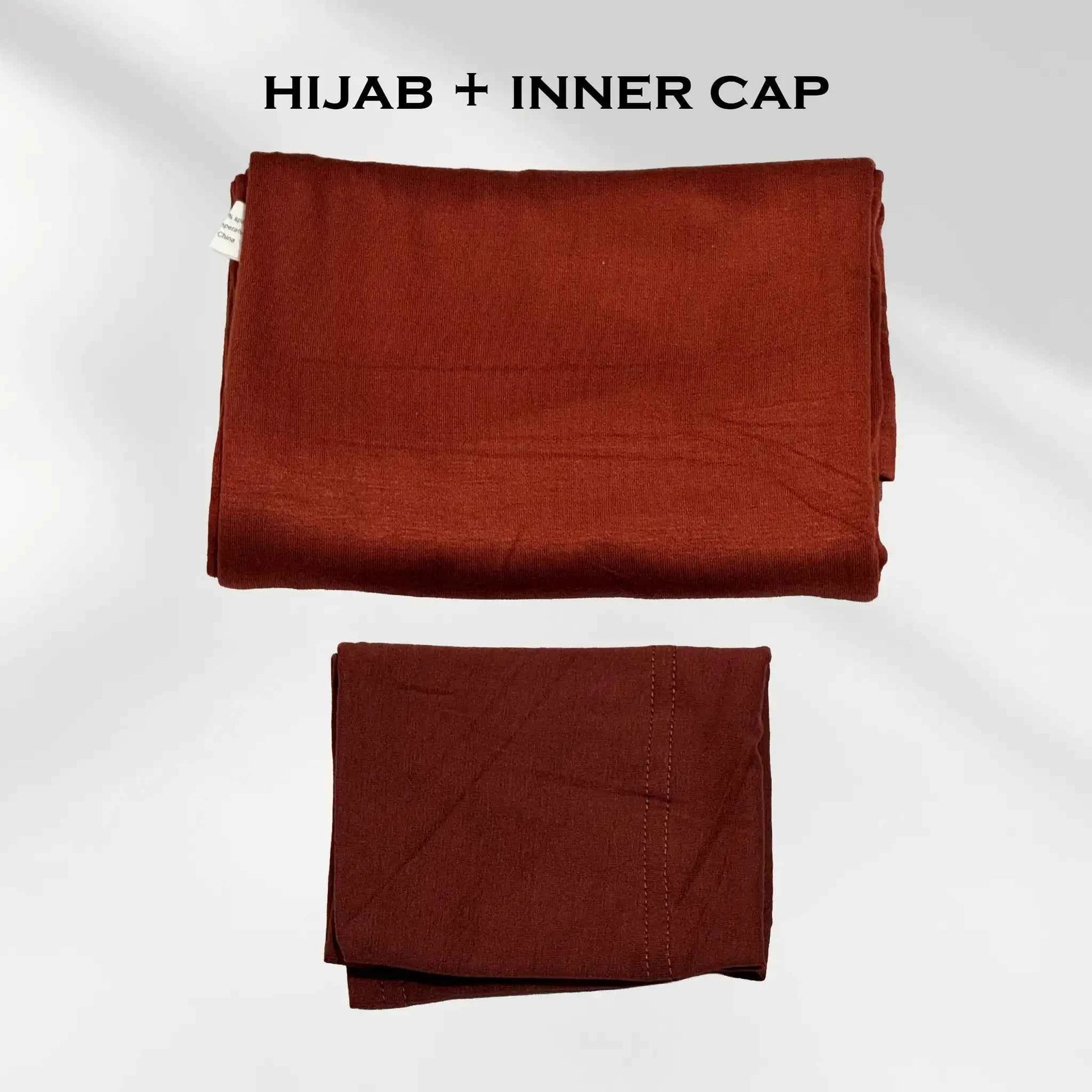 Rust red jersey hijab shown with the separate matching hijab cap beside it