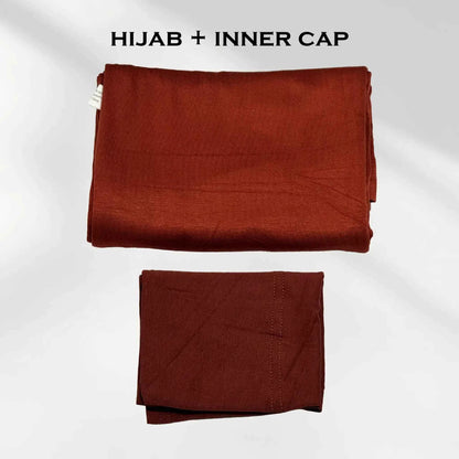 Rust red jersey hijab shown with the separate matching hijab cap beside it