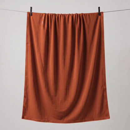 Full length red jersey hijab hanging on a line
