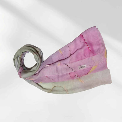 Watercolor printed modal hijab folded to show the pink, lilac and grey pastel wash