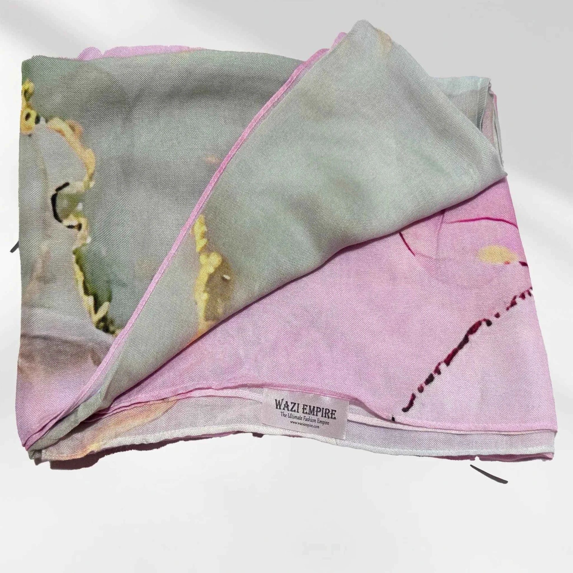 Watercolor printed modal hijab with the Wazi Empire woven label visible