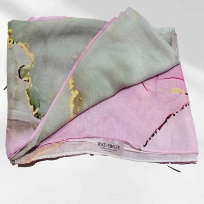 Watercolor printed modal hijab with the Wazi Empire woven label visible